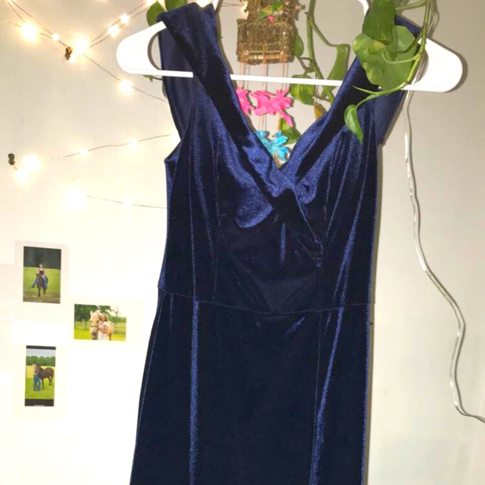 A navy blue tight fitted dress